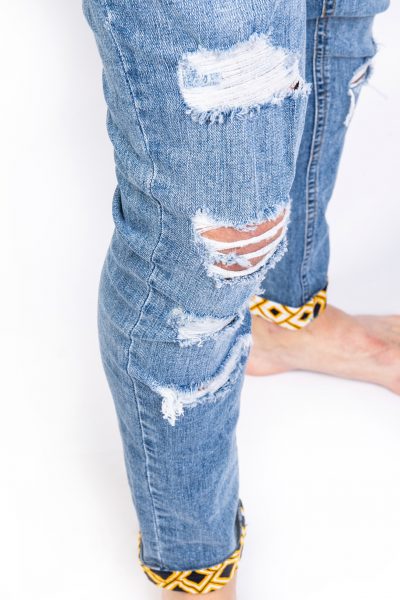 Light blue ripped jeans side
